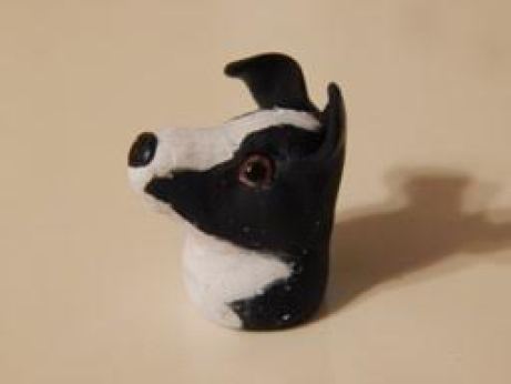 This is a clay dog that Allison from this Etsy shop: https://www.etsy.com/shop/WeeLittleCrafts?ref=hdr_shop_menu